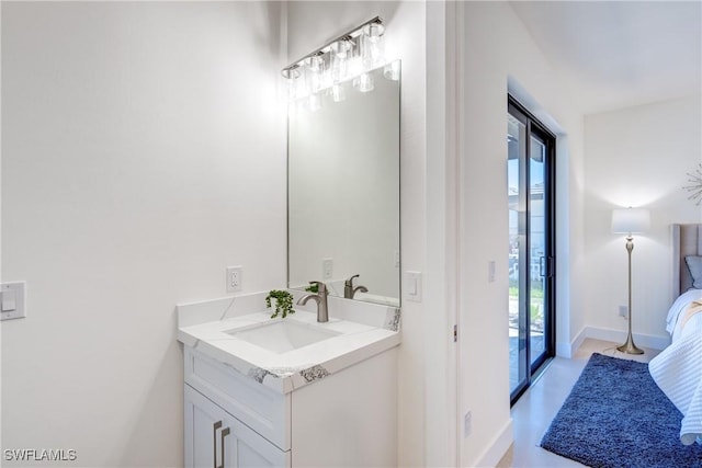 bathroom featuring baseboards and vanity