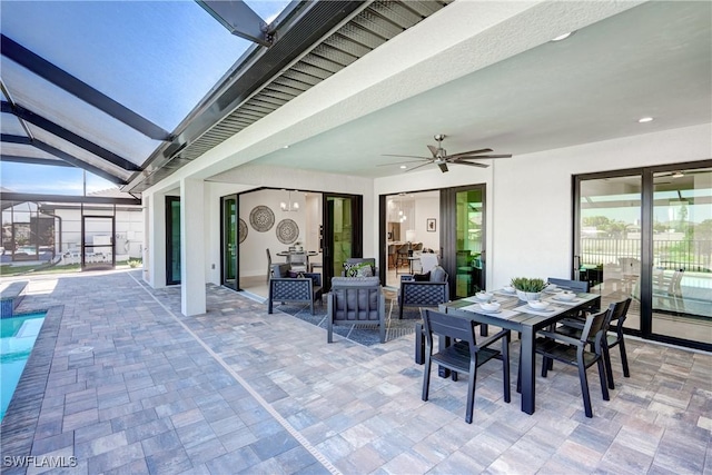 view of patio / terrace with a lanai, ceiling fan, an outdoor pool, and outdoor dining area