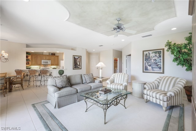 tiled living room featuring ceiling fan