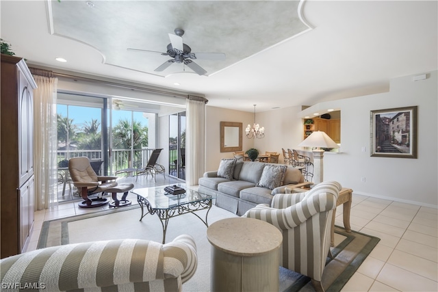 living room with ceiling fan with notable chandelier and light tile patterned flooring