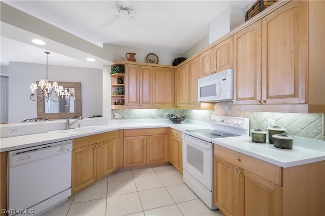 kitchen with sink, backsplash, decorative light fixtures, white appliances, and light tile patterned floors