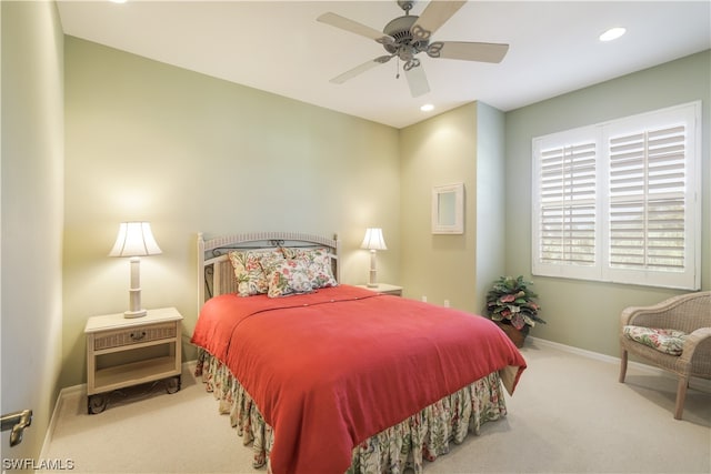 bedroom with light colored carpet and ceiling fan