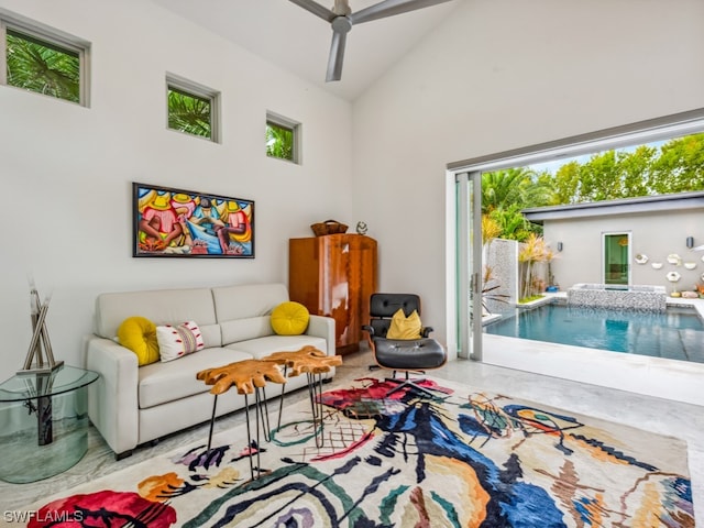 living room with high vaulted ceiling and ceiling fan