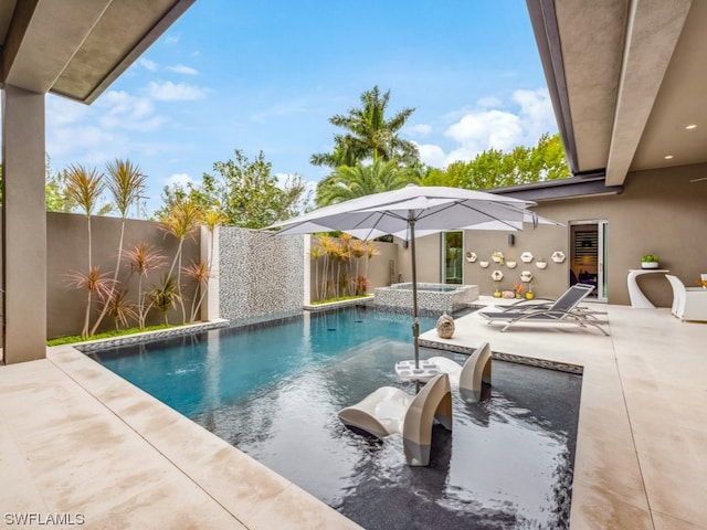 view of pool featuring an in ground hot tub and a patio area