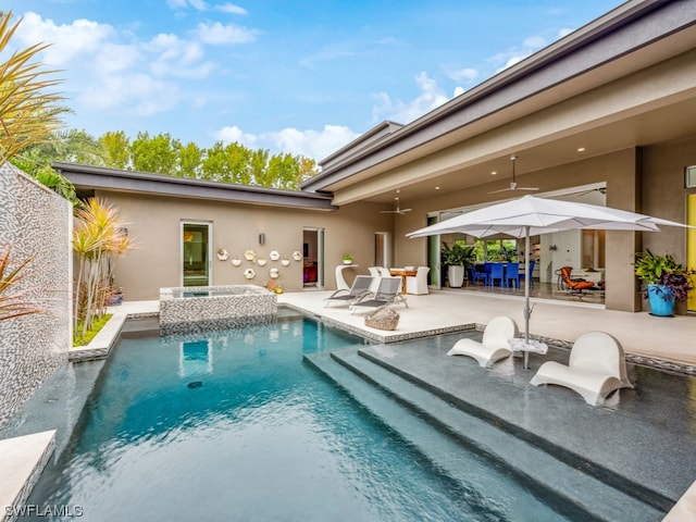 view of pool with a patio area, an in ground hot tub, and ceiling fan