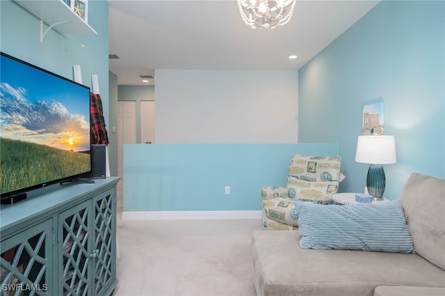 living area with carpet floors and a chandelier