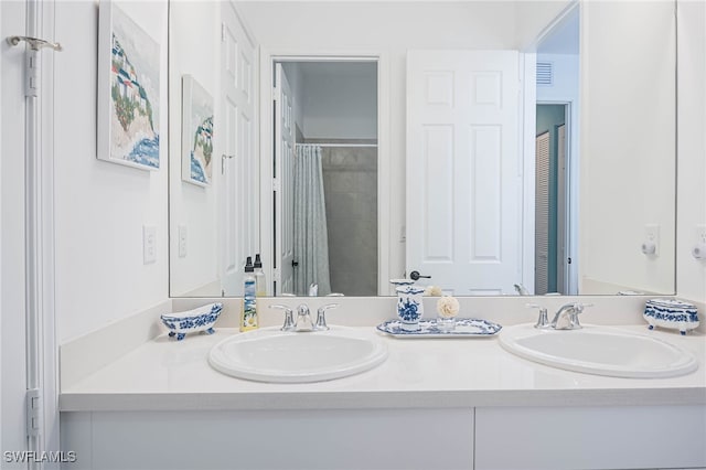 bathroom with vanity and curtained shower