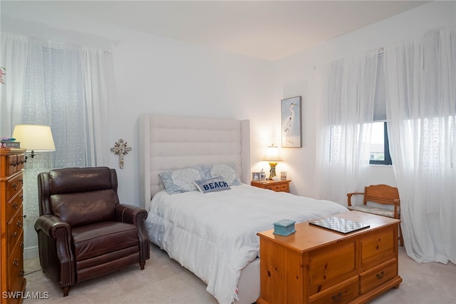 bedroom with light colored carpet