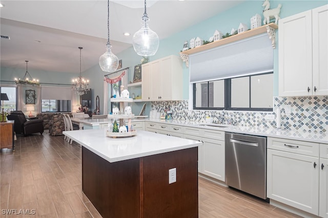 kitchen with white cabinetry, dishwasher, sink, and hanging light fixtures