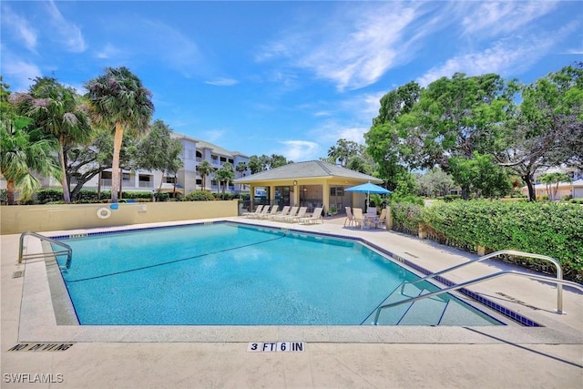 community pool with a patio area