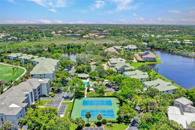 drone / aerial view with a water view and a residential view