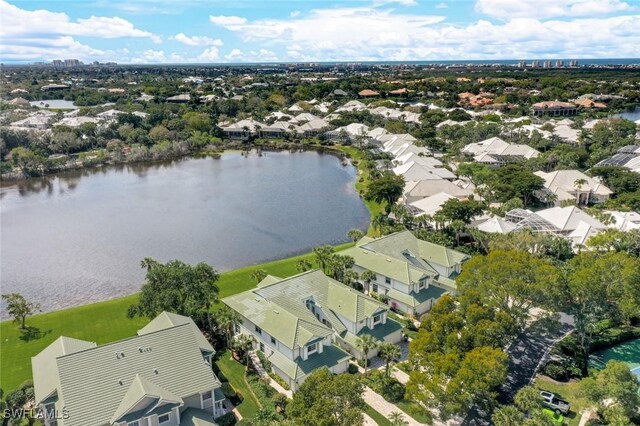 bird's eye view featuring a water view and a residential view