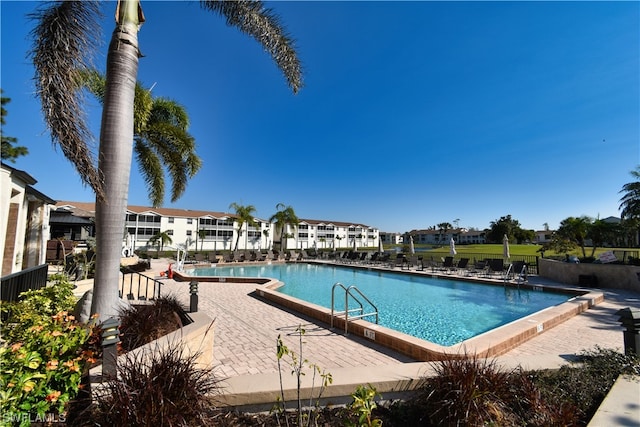 view of swimming pool with a patio area