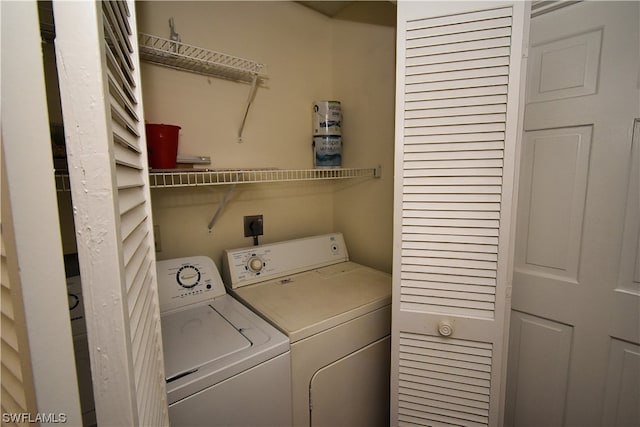 laundry area with washing machine and clothes dryer and electric dryer hookup