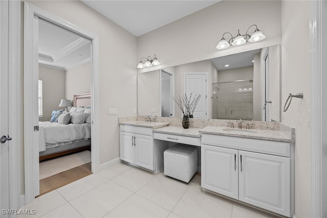 bathroom featuring vanity, ornamental molding, hardwood / wood-style flooring, and walk in shower