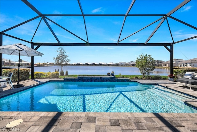 view of pool with a patio, a lanai, and a water view