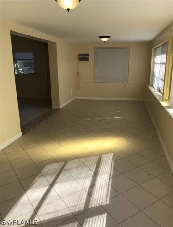 unfurnished room featuring light tile flooring