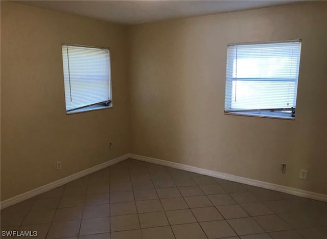 empty room featuring tile flooring