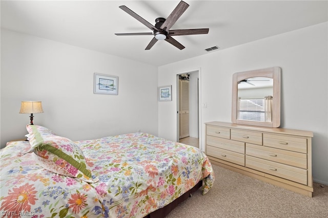 carpeted bedroom featuring ceiling fan