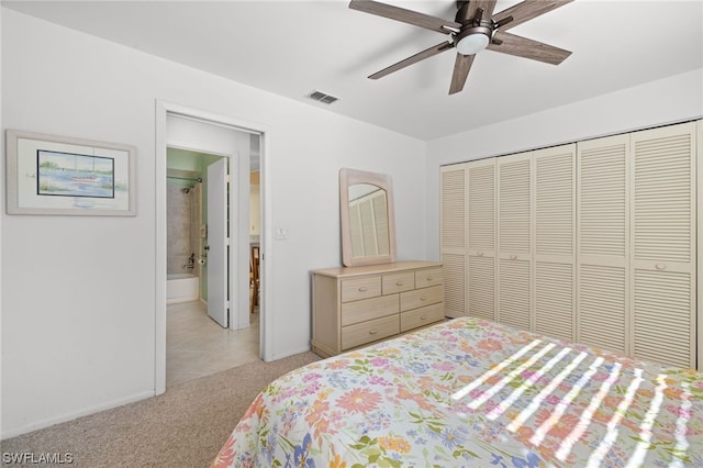 carpeted bedroom featuring ceiling fan and a closet