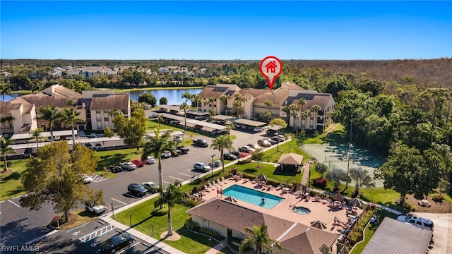 birds eye view of property featuring a water view