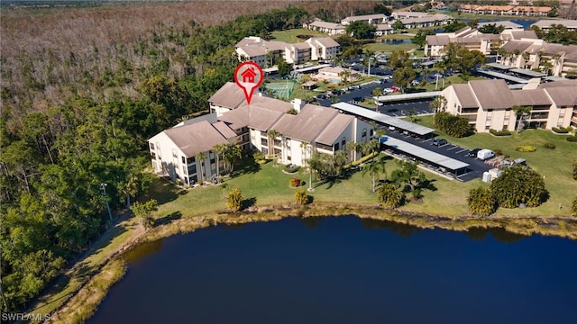 birds eye view of property featuring a water view