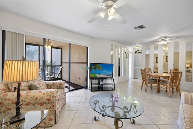 living room featuring ceiling fan and light tile patterned flooring