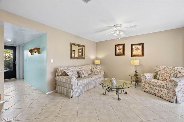 living room featuring ceiling fan and light tile patterned floors