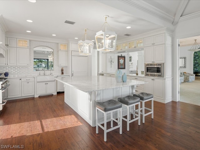 kitchen with white cabinetry and a kitchen island