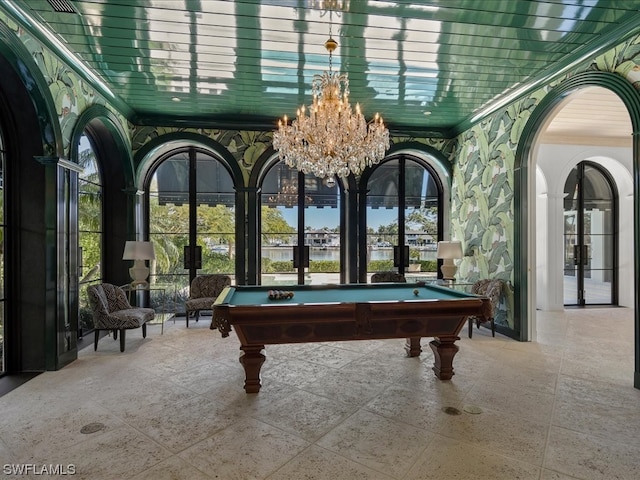 game room with french doors, a notable chandelier, and billiards