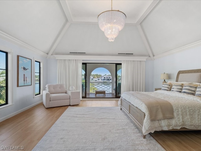 bedroom with access to outside, multiple windows, lofted ceiling with beams, and a notable chandelier