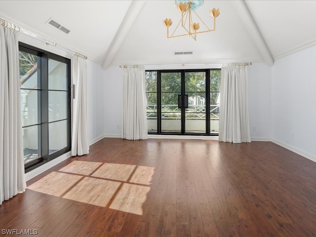 unfurnished room featuring hardwood / wood-style floors, lofted ceiling with beams, a wealth of natural light, and a chandelier