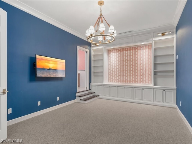 carpeted spare room featuring a chandelier, built in features, and crown molding