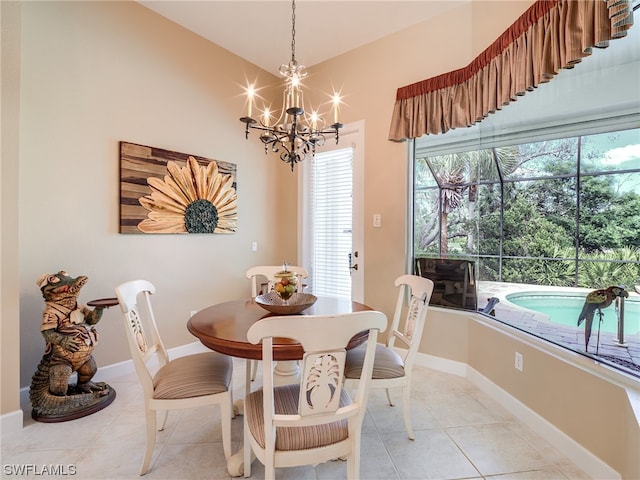 tiled dining room featuring a chandelier