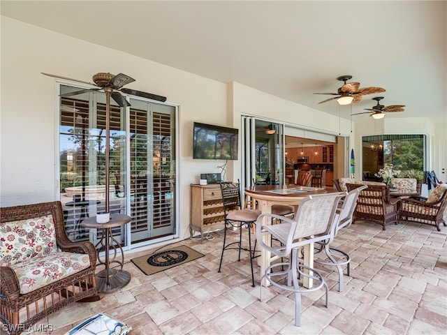 view of patio / terrace featuring ceiling fan