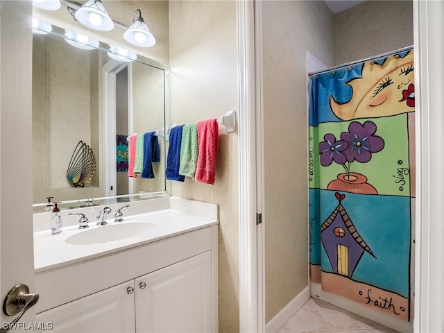 bathroom with tile flooring and oversized vanity