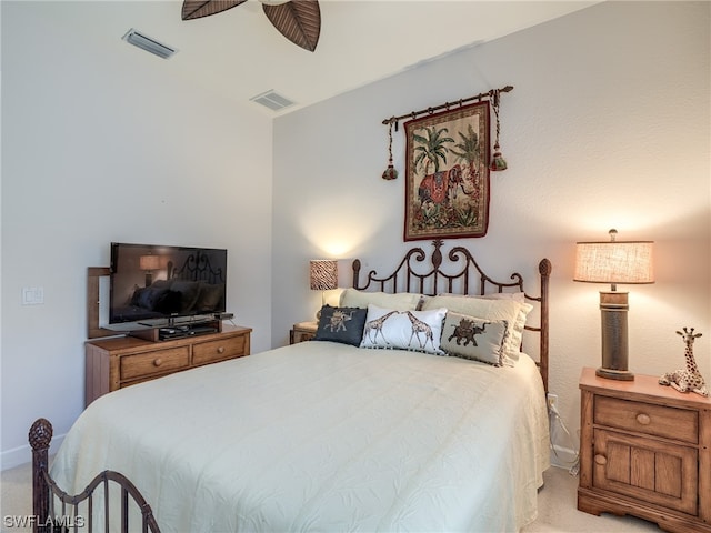 bedroom with light carpet and ceiling fan