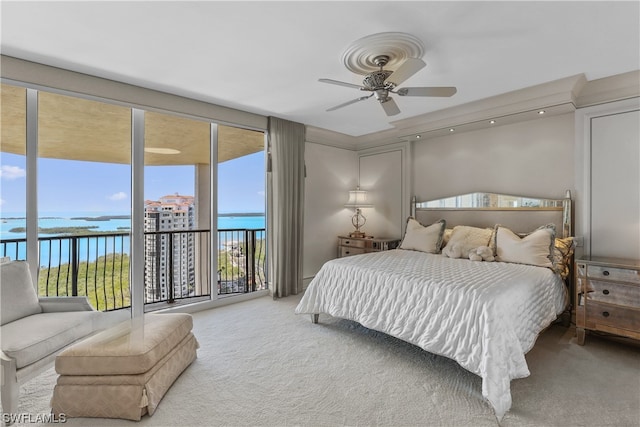 bedroom featuring access to exterior, ceiling fan, and light colored carpet