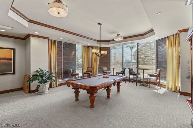 rec room with light carpet, pool table, a raised ceiling, and ornamental molding