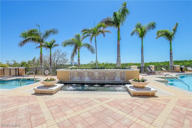 view of pool featuring a patio and pool water feature