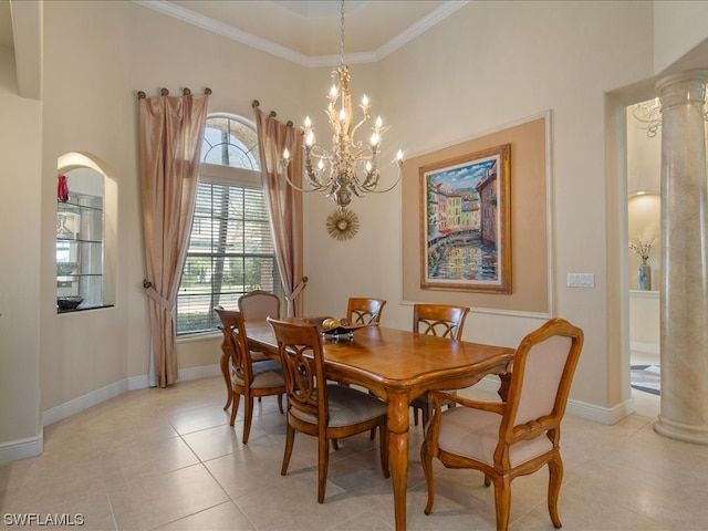 tiled dining space featuring a chandelier, crown molding, and ornate columns