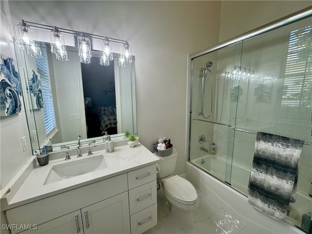 full bathroom with shower / bath combination with glass door, toilet, and vanity