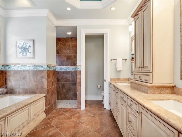 full bathroom with vanity, toilet, ornamental molding, tile walls, and tile patterned flooring