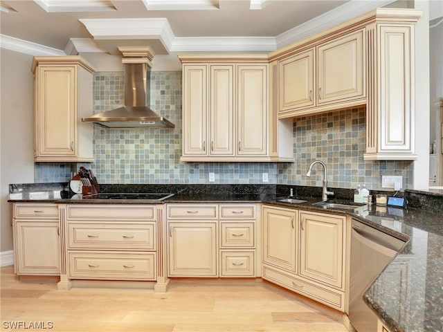 kitchen featuring wall chimney exhaust hood, sink, dark stone counters, and stainless steel dishwasher