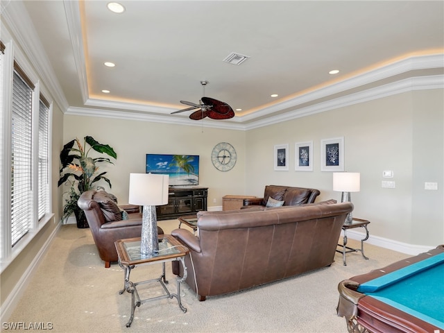 living room featuring carpet, ceiling fan, and crown molding