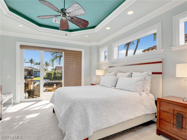 carpeted bedroom featuring multiple windows, access to exterior, ceiling fan, and crown molding