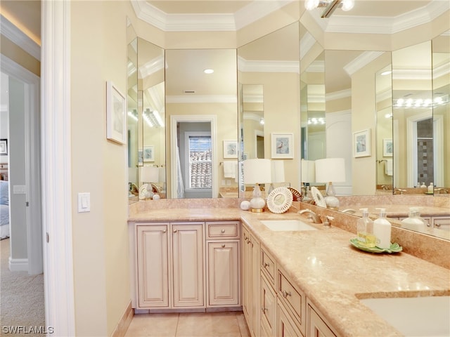 bathroom with vanity, ornamental molding, and tile patterned floors