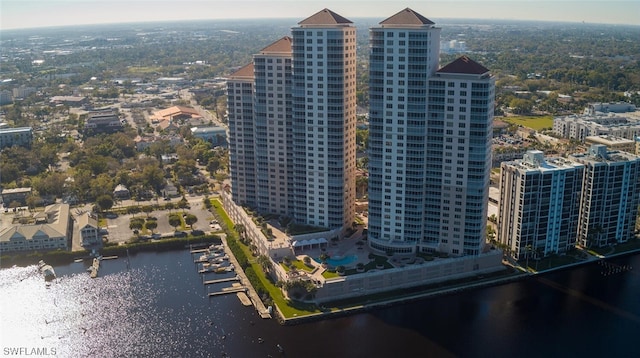 birds eye view of property with a water view