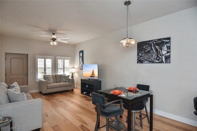 dining area featuring light wood-type flooring and ceiling fan