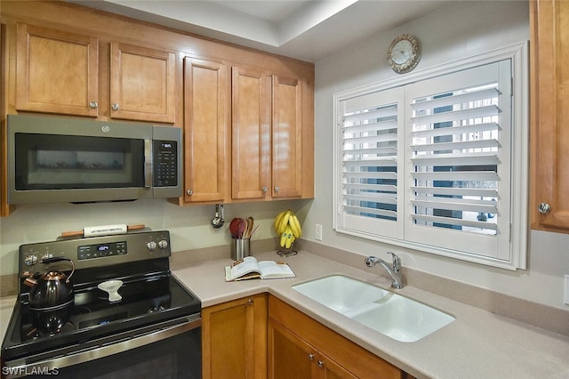 kitchen featuring stainless steel appliances, sink, and plenty of natural light